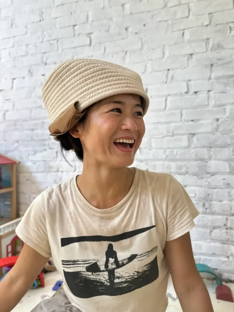 Photo of Joy wearing a basket on her head.