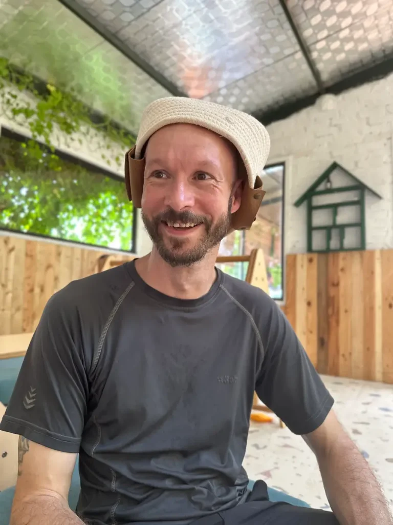 Photo of Phill wearing a basket on his head.