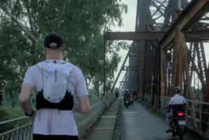 Photo of Phill running along Long Bien bridge in Hanoi